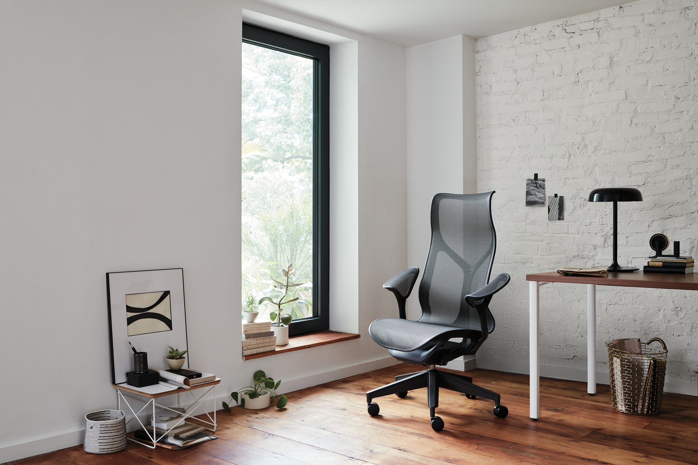 Herman Miller Cosm high-back in a bright office with brick